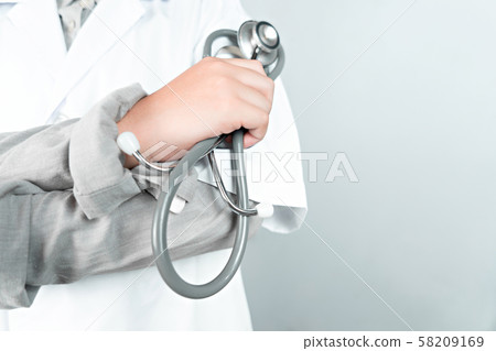 Hand holding stethoscope with copy space Hand holding stethoscope with copy space 58209169