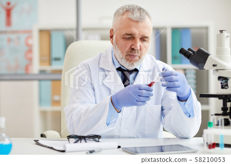 Scientist with medical sample 58210053
