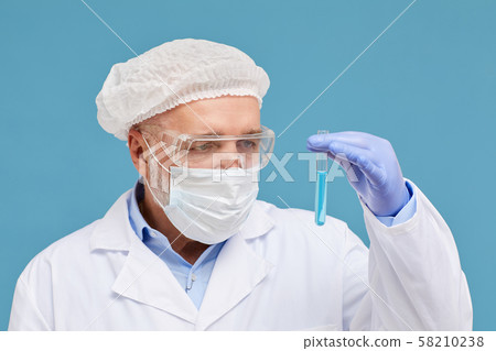 Scientist with test tube Scientist with test tube 58210238
