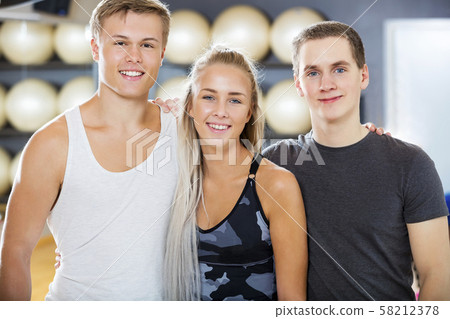 Confident Male And Female Friends Smiling In Gym 58212378
