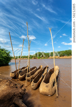 wooden coarse boat on mystical Omo river, Ethiopia wooden coarse boat on mystical Omo river, Ethiopia 58212805