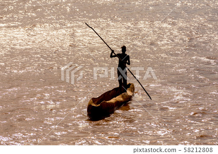 wooden coarse boat on mystical Omo river, Ethiopia 58212808