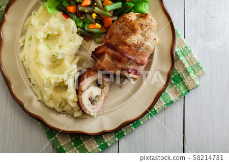 Chicken breast stuffed with champignon 58214781