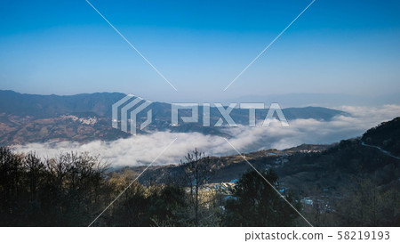 Terraced rice fields of YuanYang , China with sea Terraced rice fields of YuanYang , China with sea 58219193