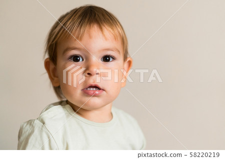 Portrait of cute baby boy isolated on the white background. Copy space. One year old Portrait of cute baby boy isolated on the white background. Copy space. One year old 58220219