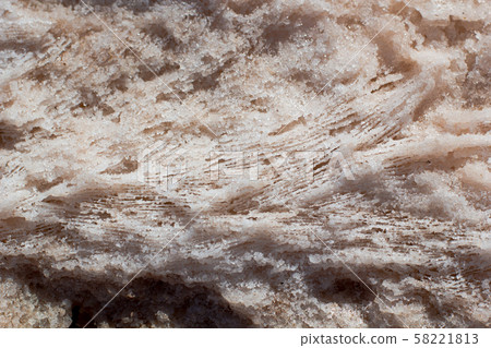 Natural pink salt crystal texture on the sand, macro, close up, lamellar structure. Salty lake shore background 58221813
