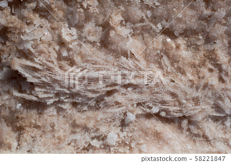 Natural pink salt crystal texture on the sand, macro, close up, lamellar structure 58221847
