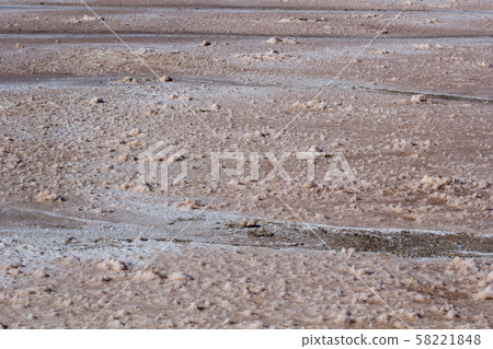 Natural white salt crystal texture on the sand, macro, close up 58221848