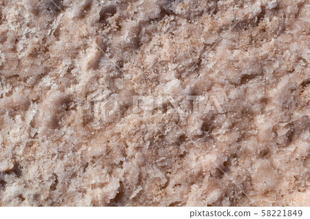 Natural pink salt crystal texture on the sand, macro, close up, lamellar structure 58221849