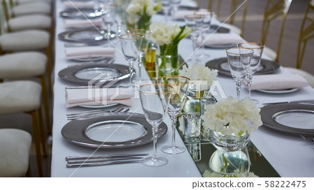 Beautifully organized event. Served festive table ready for guests. Beautifully organized event. Served festive table ready for guests. 58222475