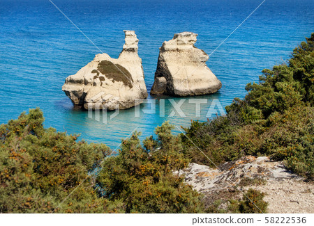 The Two Sisters stacks in front of the shore of The Two Sisters stacks in front of the shore of 58222536
