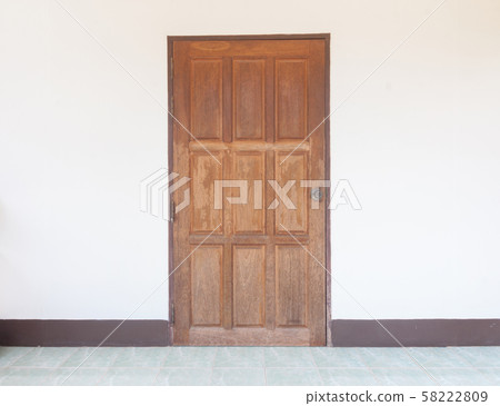 Old wood door on white wall. 58222809