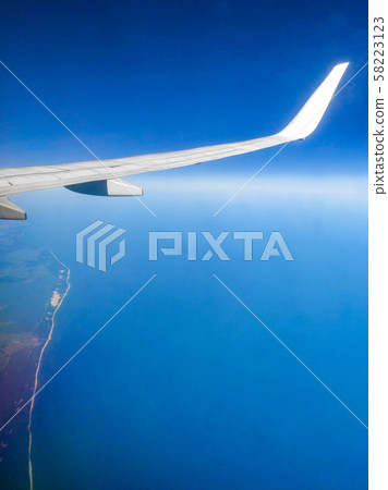 The view from the airplane window. Blue sky. 58223123