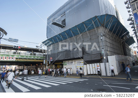 People walking on the pedestrian crossing in front of Shin-Okubo Station People walking on the pedestrian crossing in front of Shin-Okubo Station 58223207