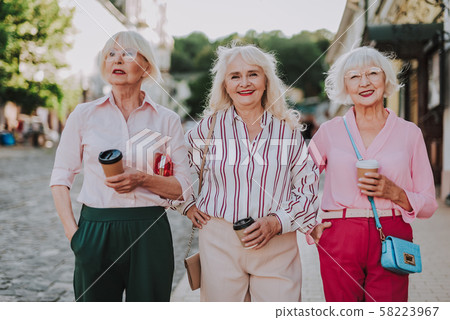 Happy stylish grandmothers are walking in the city Happy stylish grandmothers are walking in the city 58223967