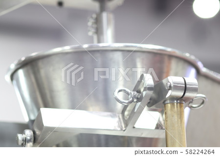 Stainless hopper is a part of machine for storage 58224264