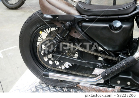 Selective focused of custom exhaust system at the motorcycle. Designed by 3rd party manufacturer to give different experience to the rider. Selective focused of custom exhaust system at the motorcycle. Designed by 3rd party manufacturer to give different experience to the rider. 58225206