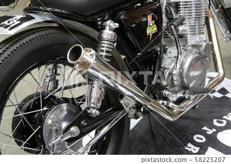 Selective focused of custom exhaust system at the motorcycle. Designed by 3rd party manufacturer to give different experience to the rider. Selective focused of custom exhaust system at the motorcycle. Designed by 3rd party manufacturer to give different experience to the rider. 58225207