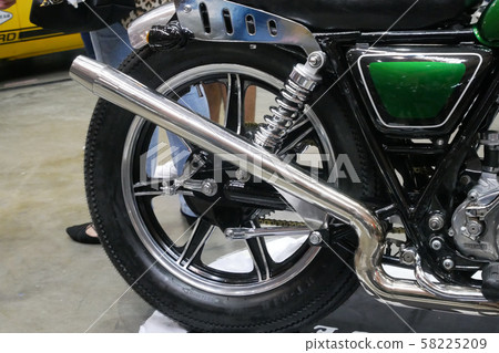 Selective focused of custom exhaust system at the motorcycle. Designed by 3rd party manufacturer to give different experience to the rider. Selective focused of custom exhaust system at the motorcycle. Designed by 3rd party manufacturer to give different experience to the rider. 58225209