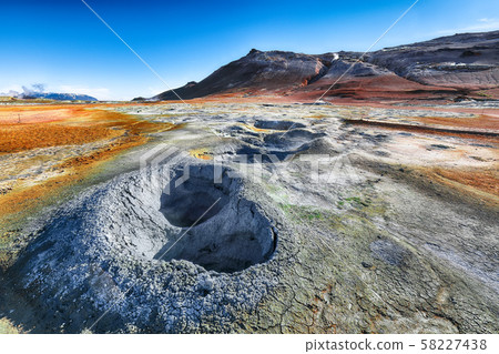 Boiling mudpots in the geothermal area Hverir and Boiling mudpots in the geothermal area Hverir and 58227438