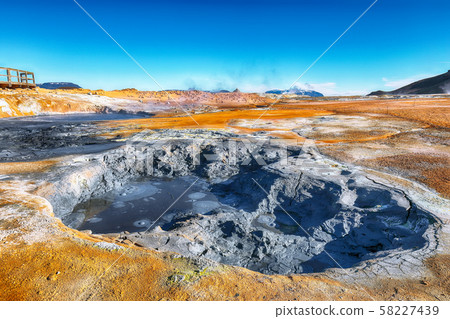 Boiling mudpots in the geothermal area Hverir and Boiling mudpots in the geothermal area Hverir and 58227439