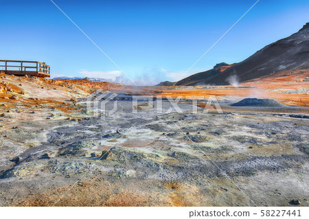 Boiling mudpots in the geothermal area Hverir and Boiling mudpots in the geothermal area Hverir and 58227441