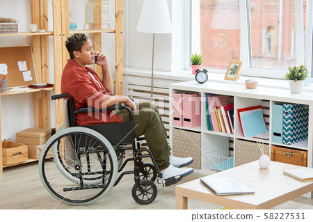 Disabled woman talking on the phone 58227531