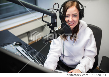 Female Jockey Smiling While Communicating On... - Stock Photo [58228131] -  PIXTA