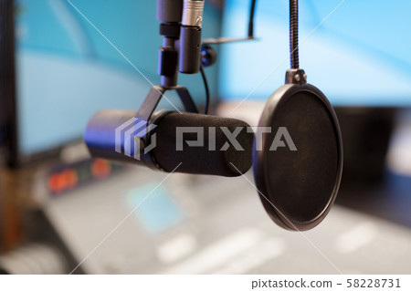 Microphone in modern radio station broadcasting studio 58228731