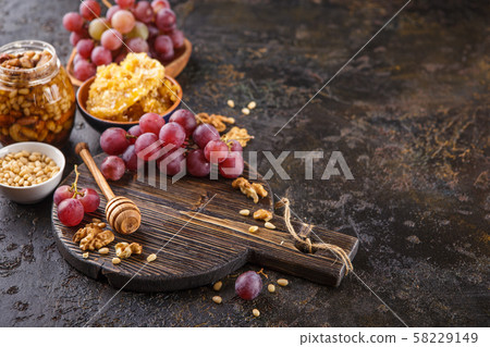 Honey, grapes and nuts 58229149