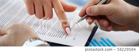 Female arm offer contract form on clipboard pad Female arm offer contract form on clipboard pad 58229504