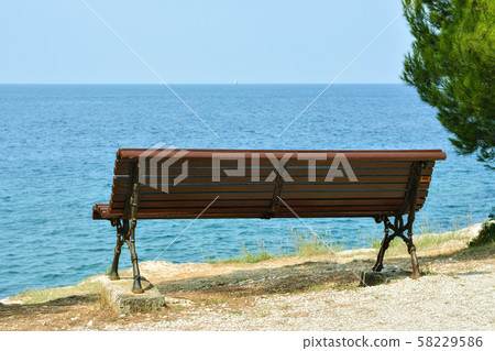 Bench by the sea. 58229586