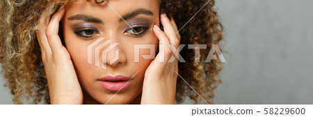 A beautiful black woman portrait. Tests the emotion 58229600
