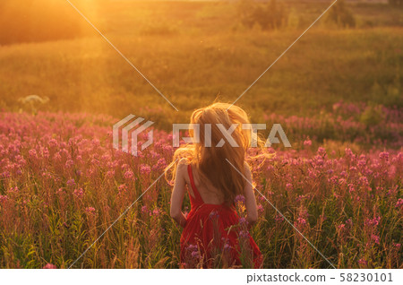 Dancing and jumping girl in red dress among Dancing and jumping girl in red dress among 58230101