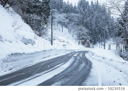 Snow-covered road Snow-covered road 58230516