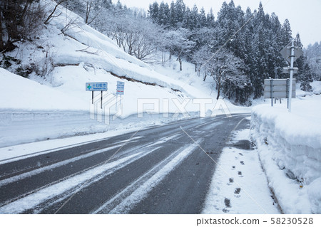 Snow-covered road  58230528