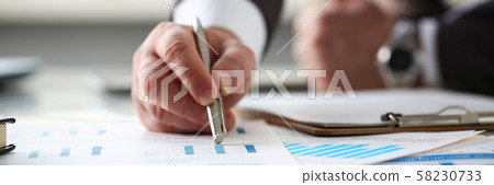 Male arm point silver pen at important paper Male arm point silver pen at important paper 58230733