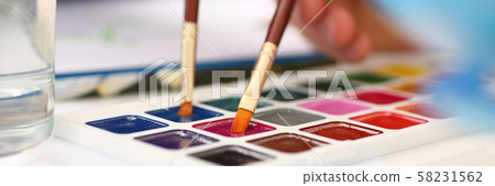 Brush point in watercolor paint closeup 58231562