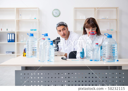 Two chemists working in the lab Two chemists working in the lab 58232115