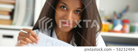 Beautiful black smiling female doctor hold Beautiful black smiling female doctor hold 58232404