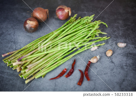Fresh asparagus bunch on dark background - Fresh asparagus bunch on dark background - 58233318
