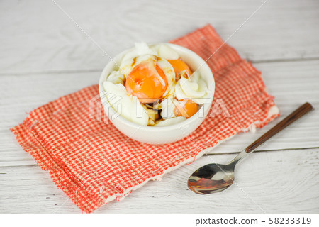 boiled egg on bowl with sauce for breakfast on the boiled egg on bowl with sauce for breakfast on the 58233319