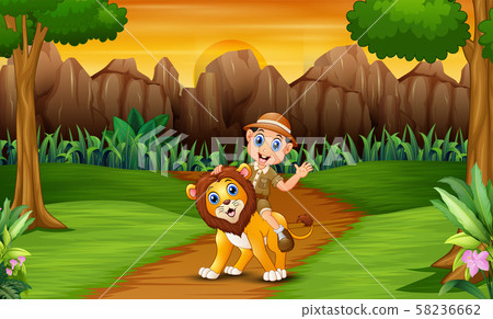 Happy zookeeper man with a lion in the jungle 58236662
