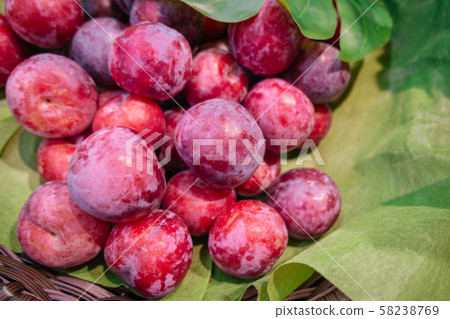 A pile of fresh organic red plums 58238769