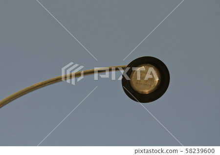 Silhouette of a street lamp at day Silhouette of a street lamp at day 58239600