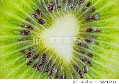 Closeup a slice of fresh kiwi fruit Closeup a slice of fresh kiwi fruit 58241234