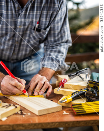 Craftsman at work on wooden boards. Carpentry. Craftsman at work on wooden boards. Carpentry. 58241588