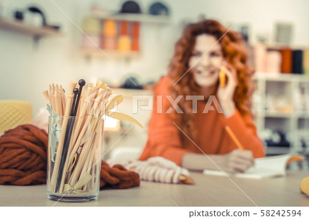 Focused photo on wooden needles that being in glass Focused photo on wooden needles that being in glass 58242594