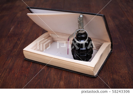hand grenade hidden in a book hand grenade hidden in a book 58243306