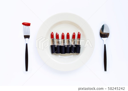 Lipsticks on white dish with fork and spoon Lipsticks on white dish with fork and spoon 58245242